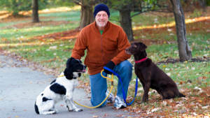 man-middle-age-dogs-woods-1col.jpg